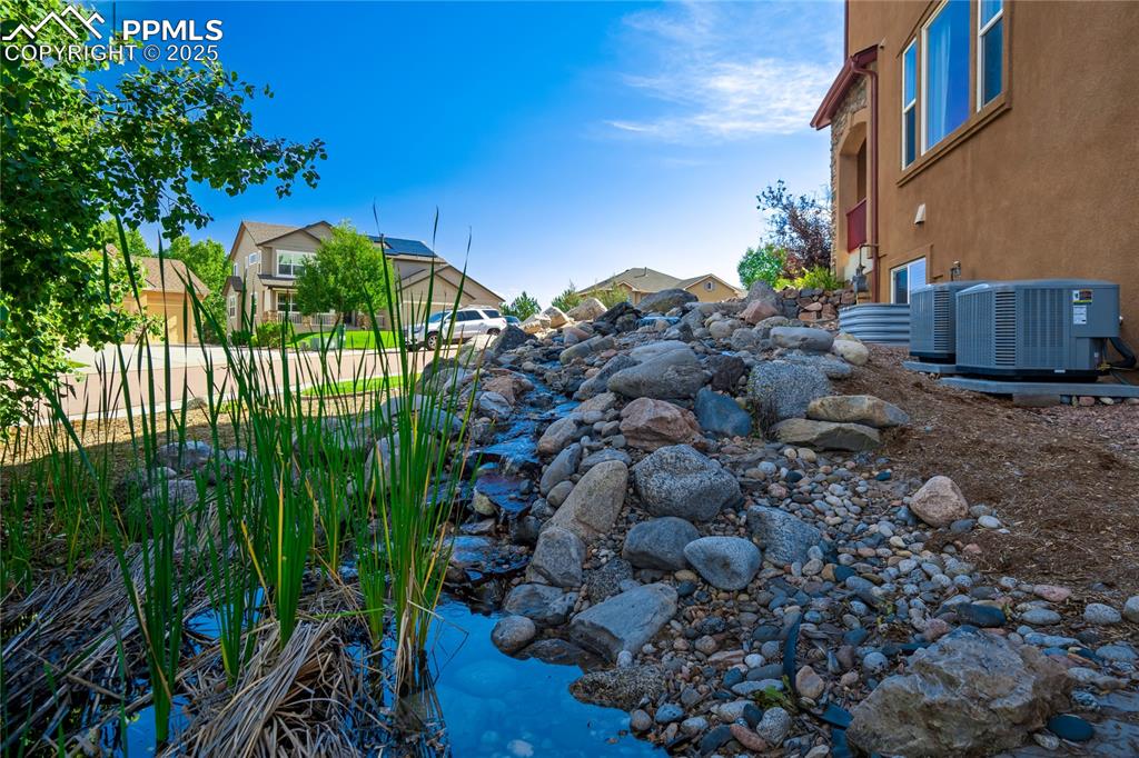 Image 39 of 43: View of yard featuring a garden pond