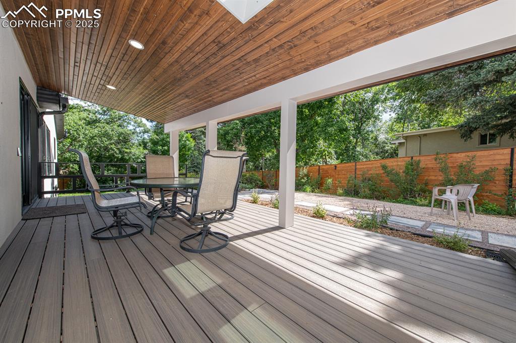 Image 14 of 50: Cozy composite covered deck to keep you cool