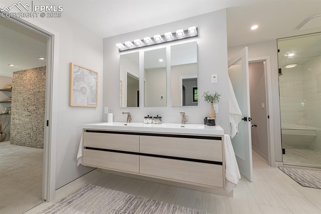 Image 21 of 50: Modern Master bath has 2 mirrored medicine cabinets