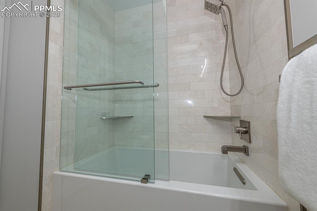 Image 28 of 50: Full main level bath with custom appointments