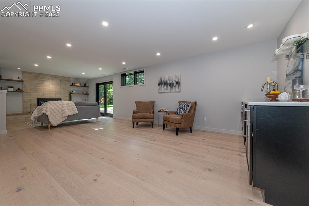 Image 31 of 50: Basement Rec Room wet bar and game table area