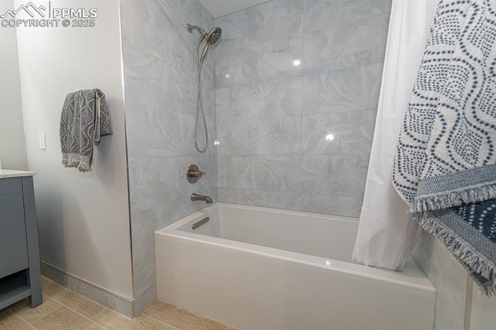 Image 36 of 50: Basement full bath with custom appointments