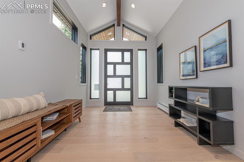 Image 4 of 50: Elegant entry with custom door