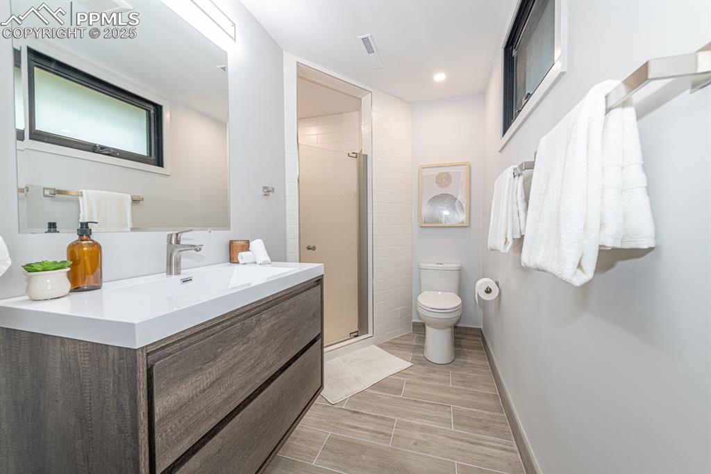 Image 42 of 50: Au pair suite bath with custom appointments