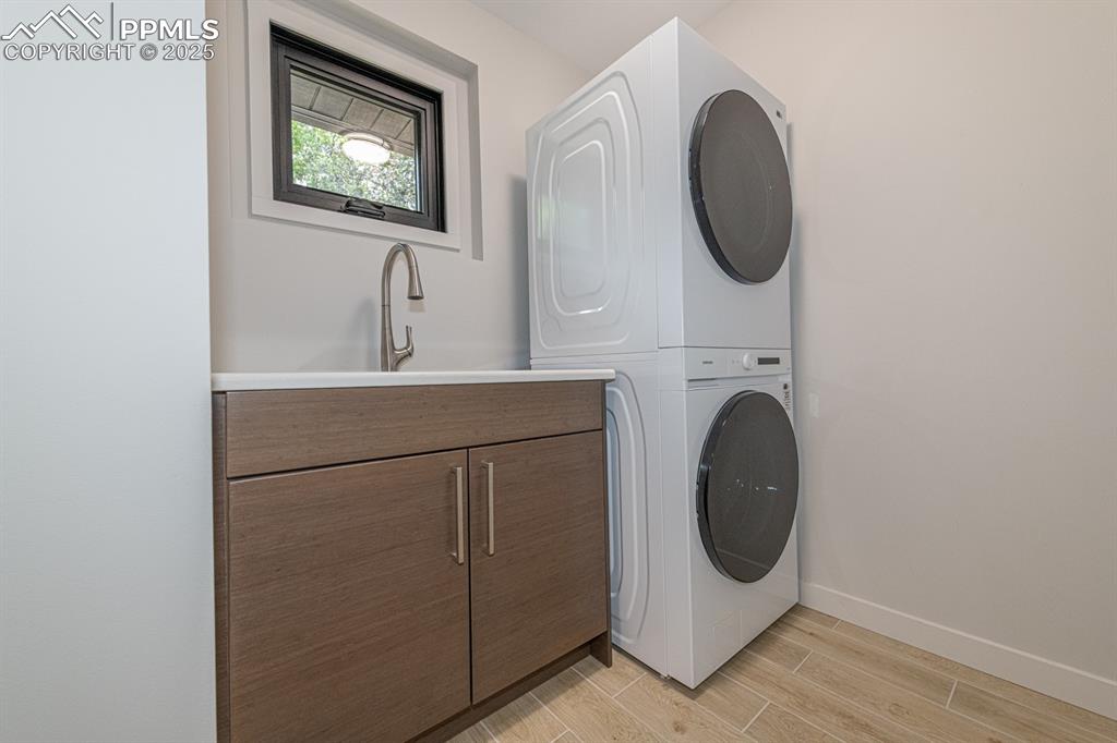 Image 46 of 50: Main level laundry with utility sink