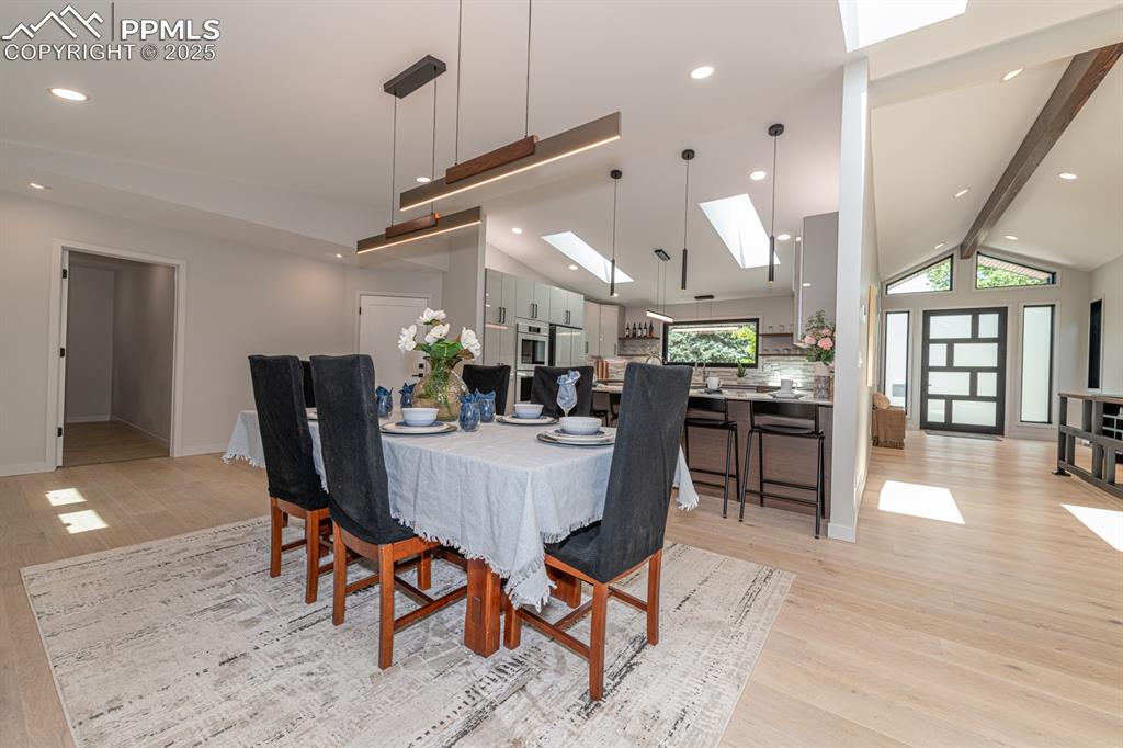 Image 5 of 50: great room concept with lots of skylights