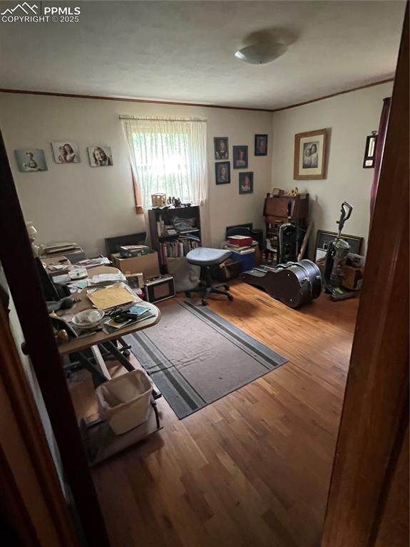Image 24 of 50: 2nd main level bedroom that could be used as an office, with 2 windows for