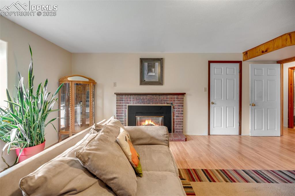 Image 26 of 50: Large family room with front window