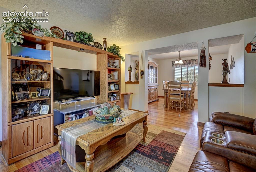Image 4 of 50: Living room view into the Formal Dining Room