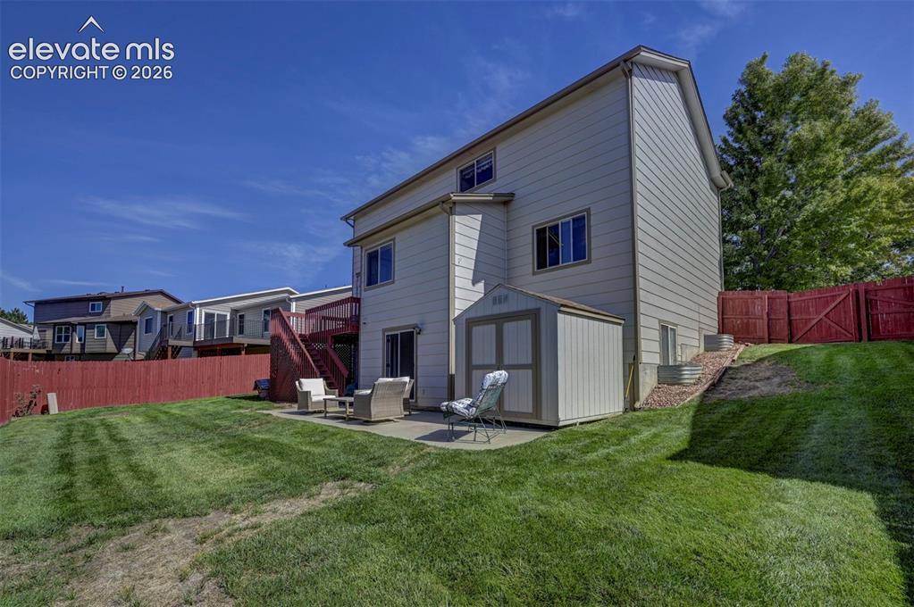 Image 46 of 50: View of the backyard. Shed included.
