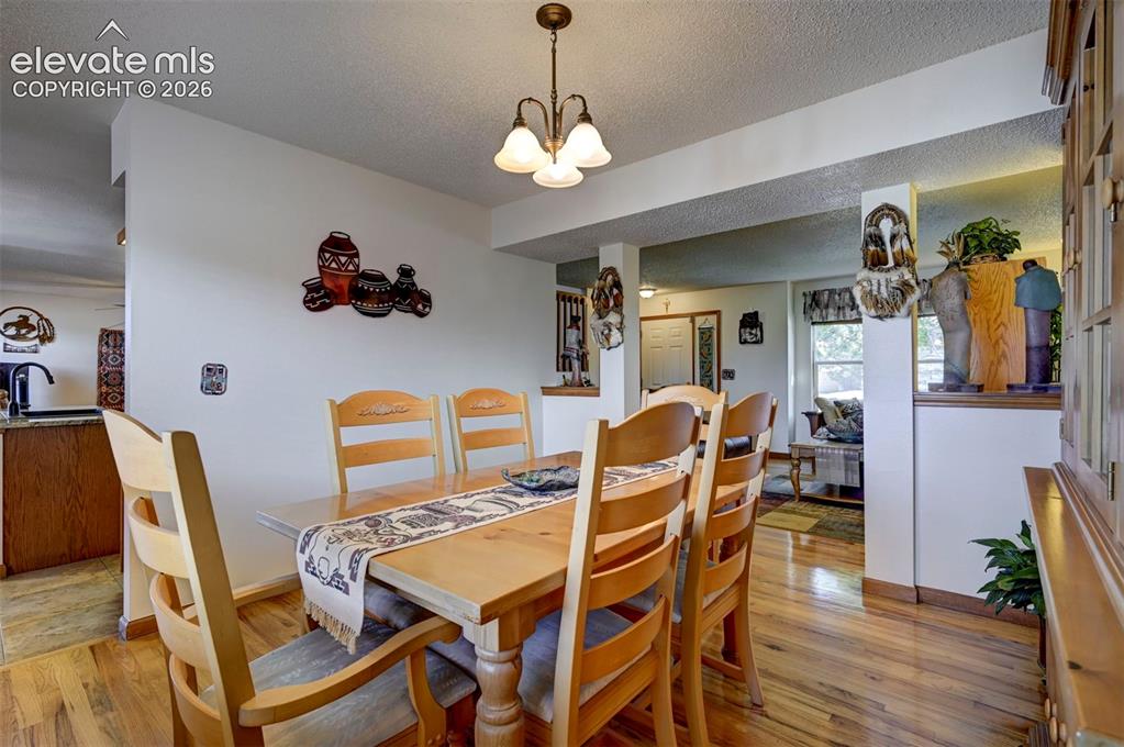Image 6 of 50: Formal dining room leading into the kitchen.