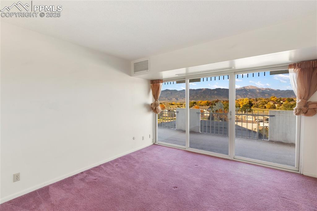 Image 27 of 41: Bedroom 1, with a view