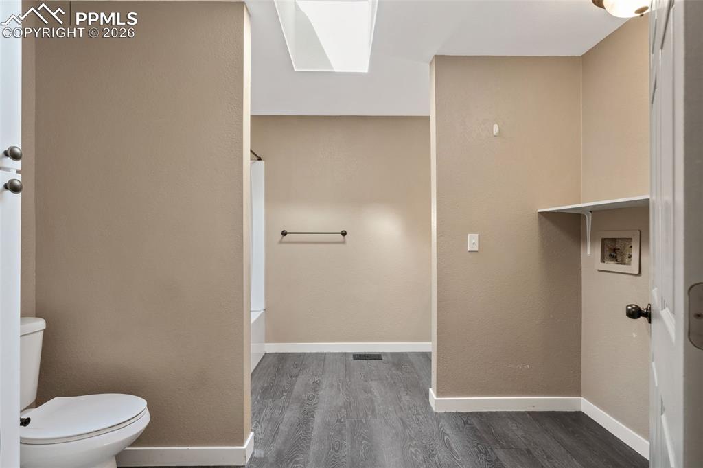 Image 15 of 28: Bathroom with Laundry