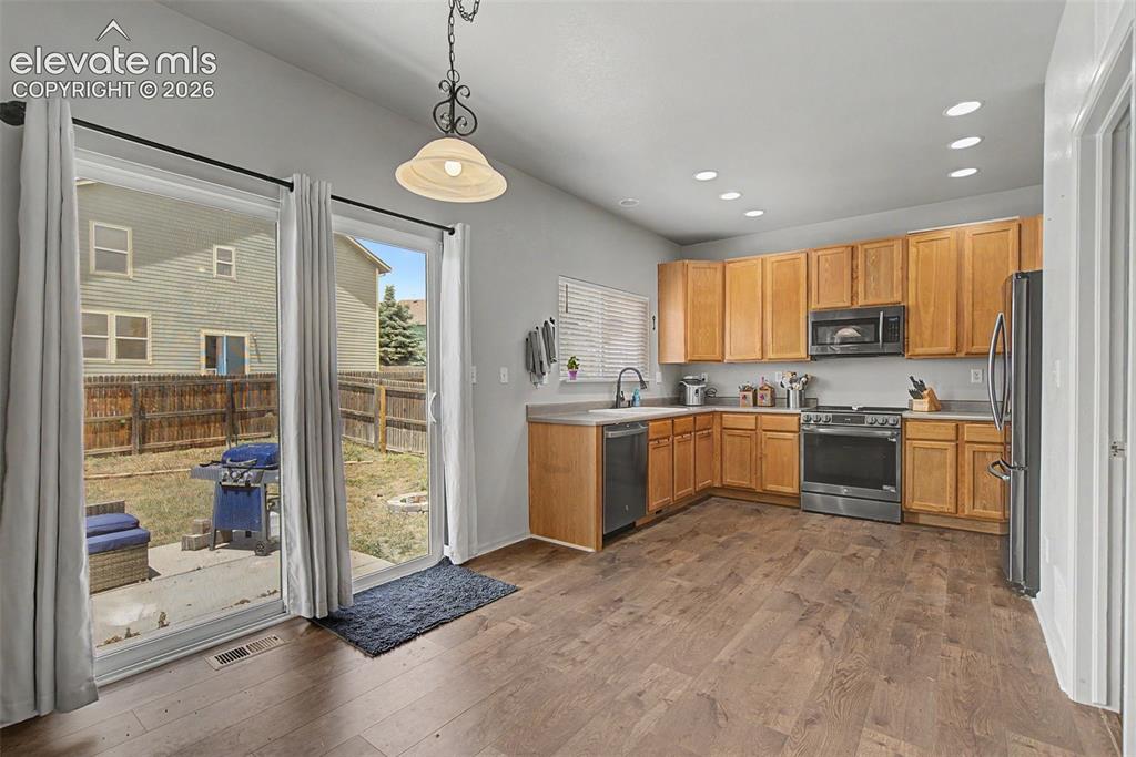 Image 10 of 28: Kitchen with Abundant Cabinetry