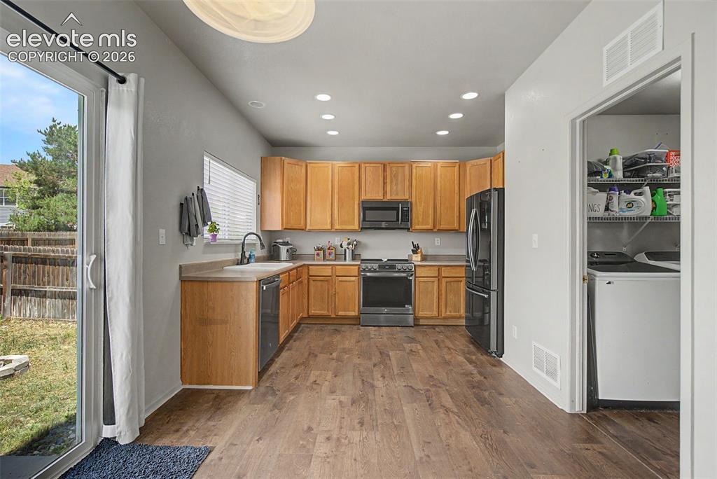 Image 11 of 28: Kitchen with Access to Laundry