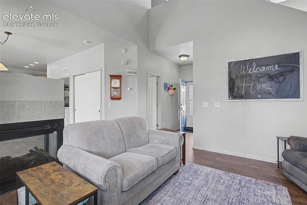 Image 7 of 28: Comfortable Main-Level Living Space with Gas Fireplace