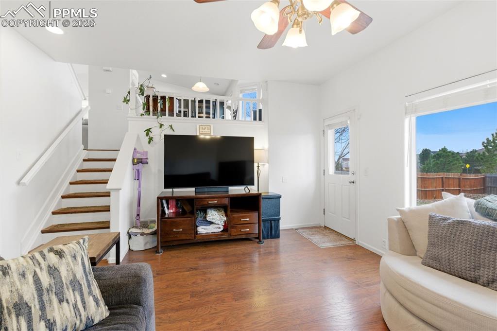 Image 19 of 44: Living area featuring ceiling fan and wood finished floors