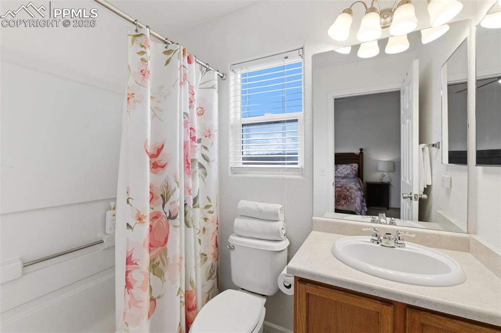 Image 25 of 44: Full bathroom with vanity, ensuite bath, and shower / bathtub combination w