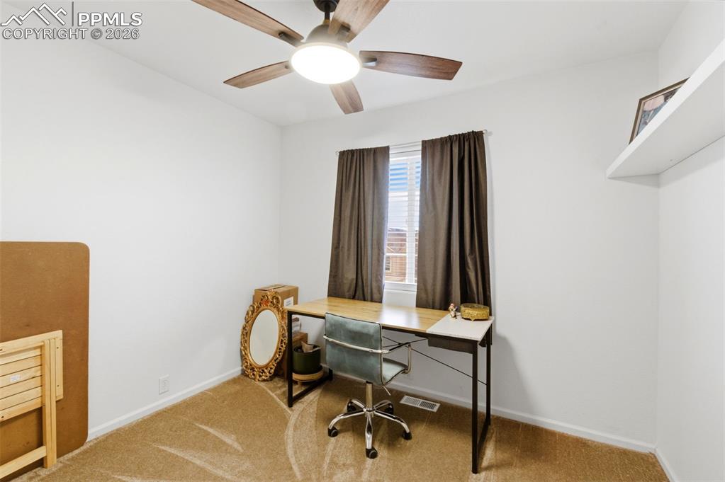 Image 30 of 44: Office with carpet flooring and ceiling fan