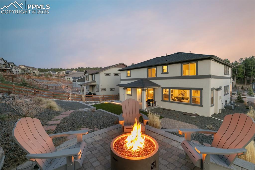 Image 47 of 49: Backyard with multiple outdoor spaces