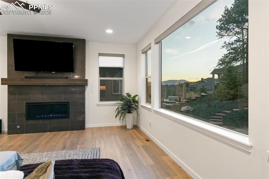 Image 7 of 49: Floor to ceiling modern tiled fireplace