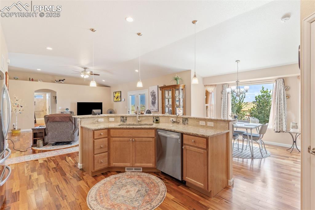 Image 13 of 33: Kitchen with stainless steel dishwasher, recessed lighting, open floor plan
