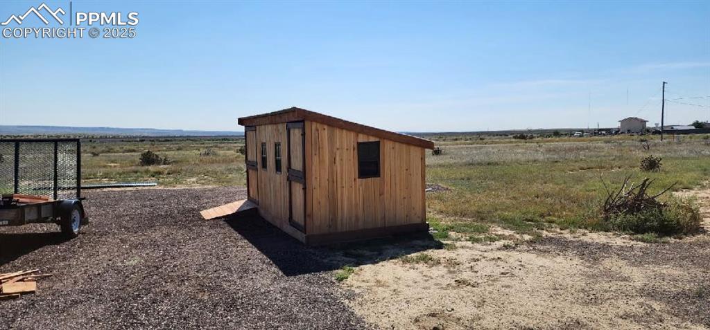 Image 32 of 33: View of shed featuring a view of rural / pastoral area