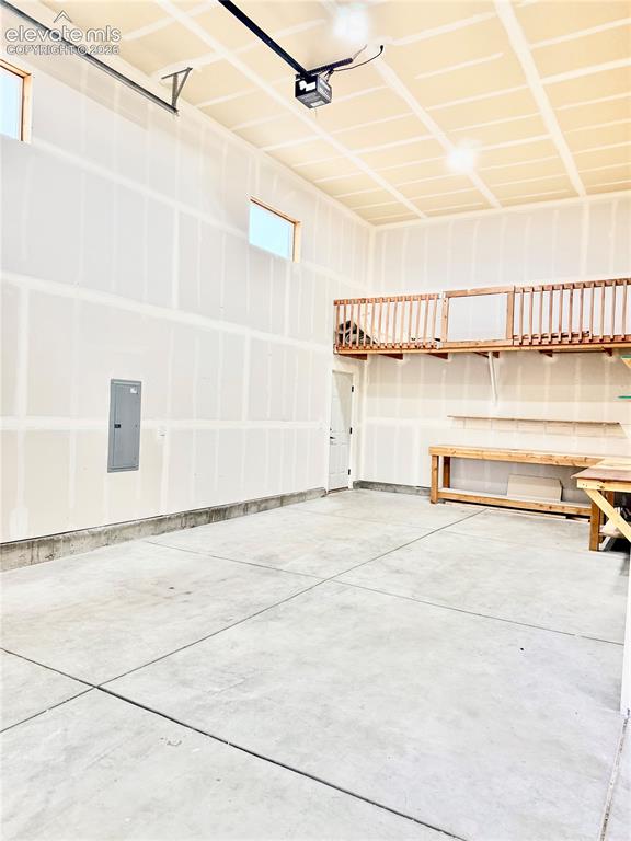 Image 32 of 38: Spacious room featuring light-colored carpeting, white wall paint, and dark