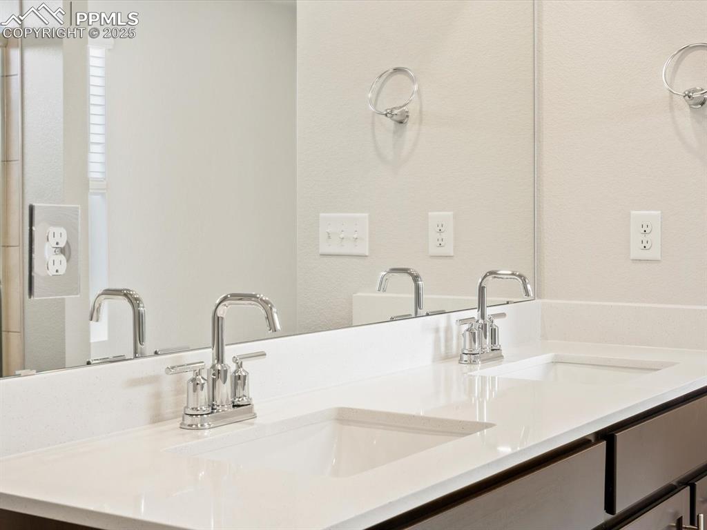 Image 31 of 36: Bathroom featuring double vanity