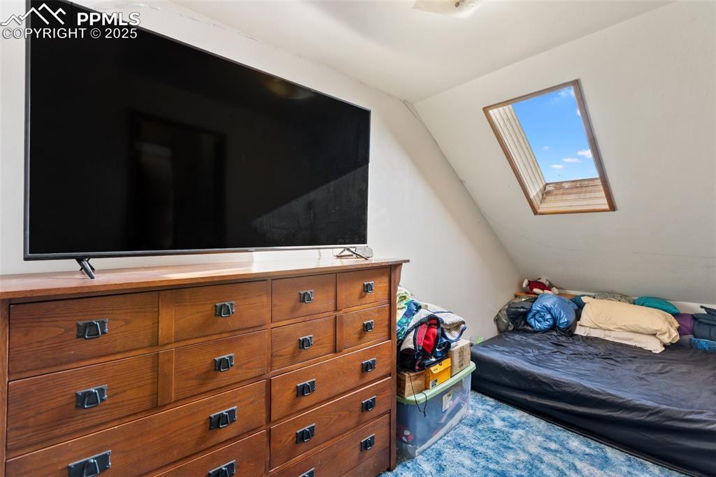 Image 29 of 42: Bonus room upstairs, non-comforming bedroom