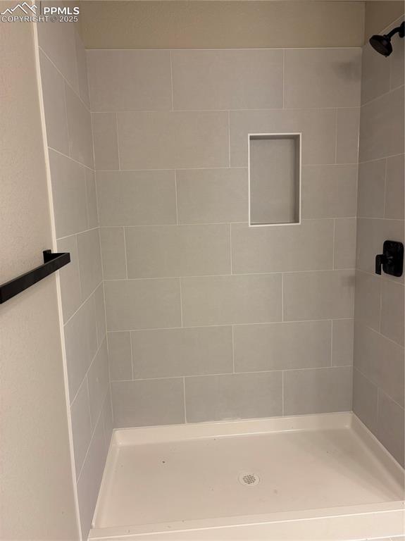 Image 10 of 16: Bathroom with a shower stall