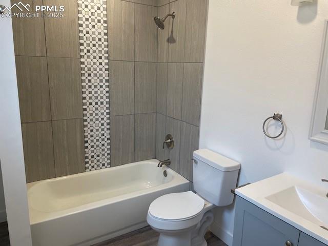 Image 8 of 17: Full bathroom with toilet, vanity, and shower / bath combination