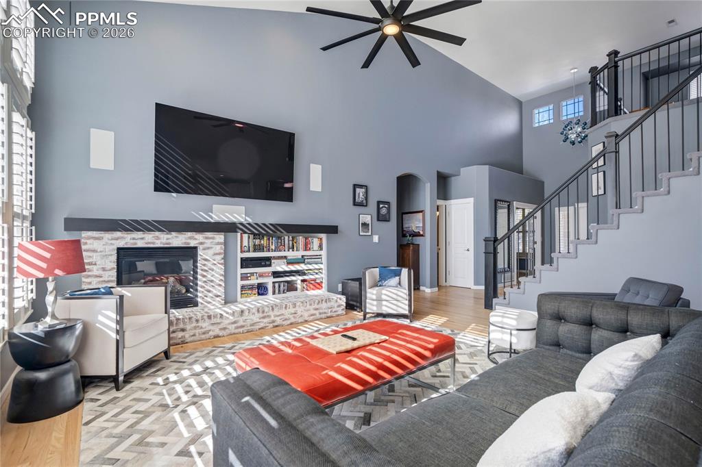 Image 12 of 50: Gas fireplace for those cold Colorado nights and built-ins!