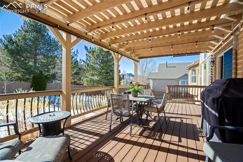 Image 19 of 50: Walkout from the kitchen to the covered deck.