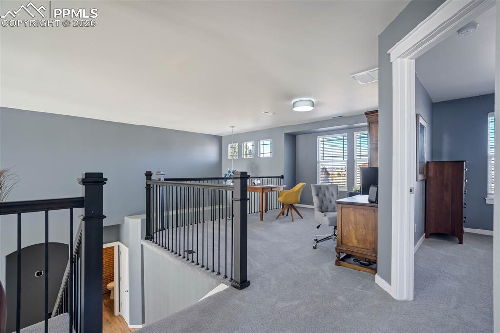 Image 29 of 50: Spacious upper level loft ideal for secondary home office.