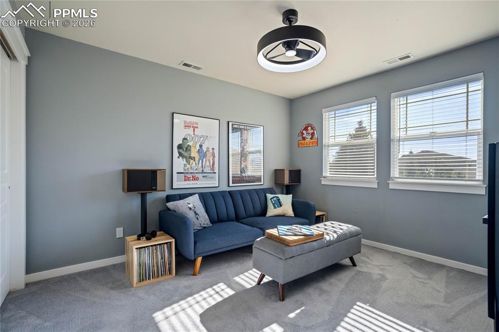 Image 31 of 50: One of two secondary bedrooms on upper level.