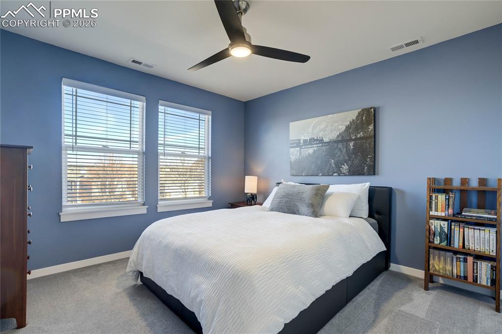 Image 33 of 50: Upper level bedroom.