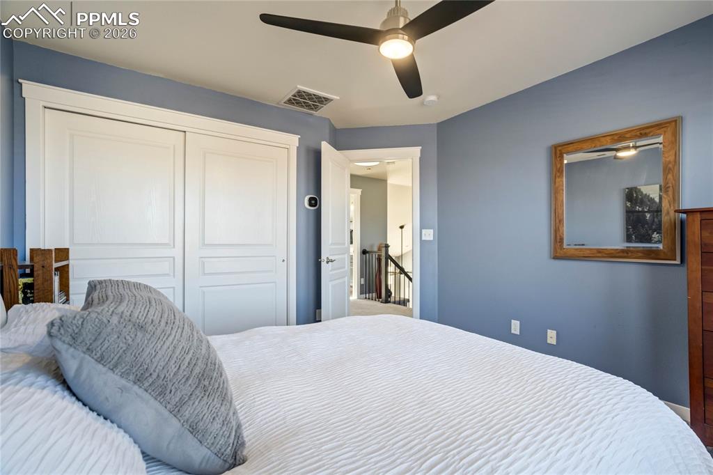 Image 34 of 50: Upper level bedroom.