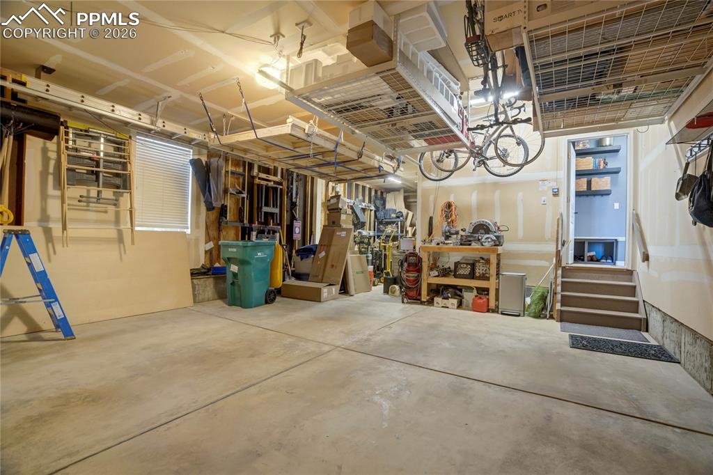 Image 45 of 50: Tandem 3-car garage.