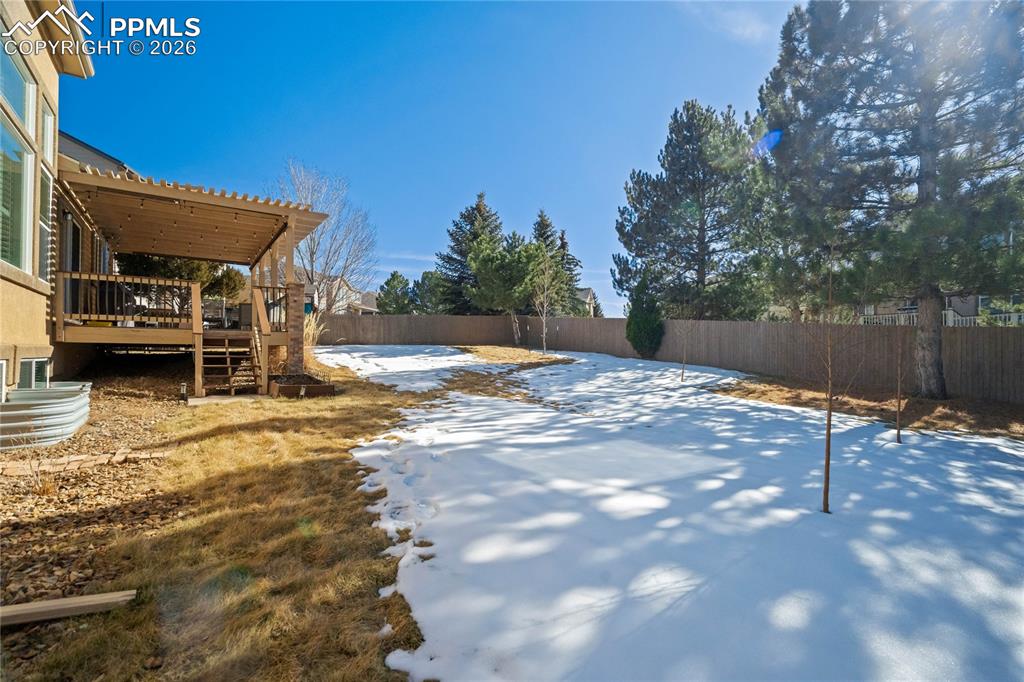 Image 47 of 50: Large, fenced backyard with room for outdoor entertaining.