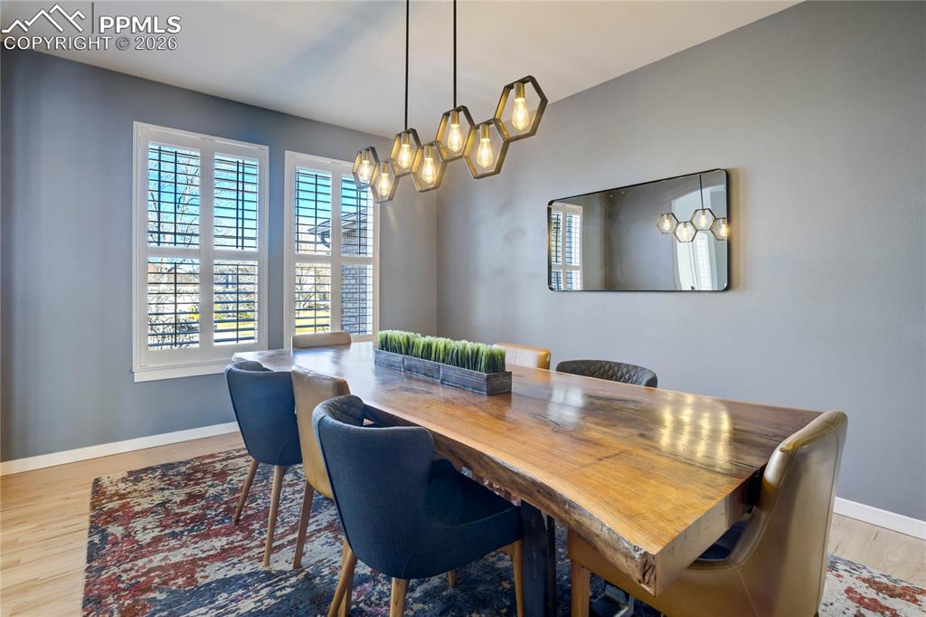 Image 8 of 50: Formal dining room with plenty of space for all to gather.