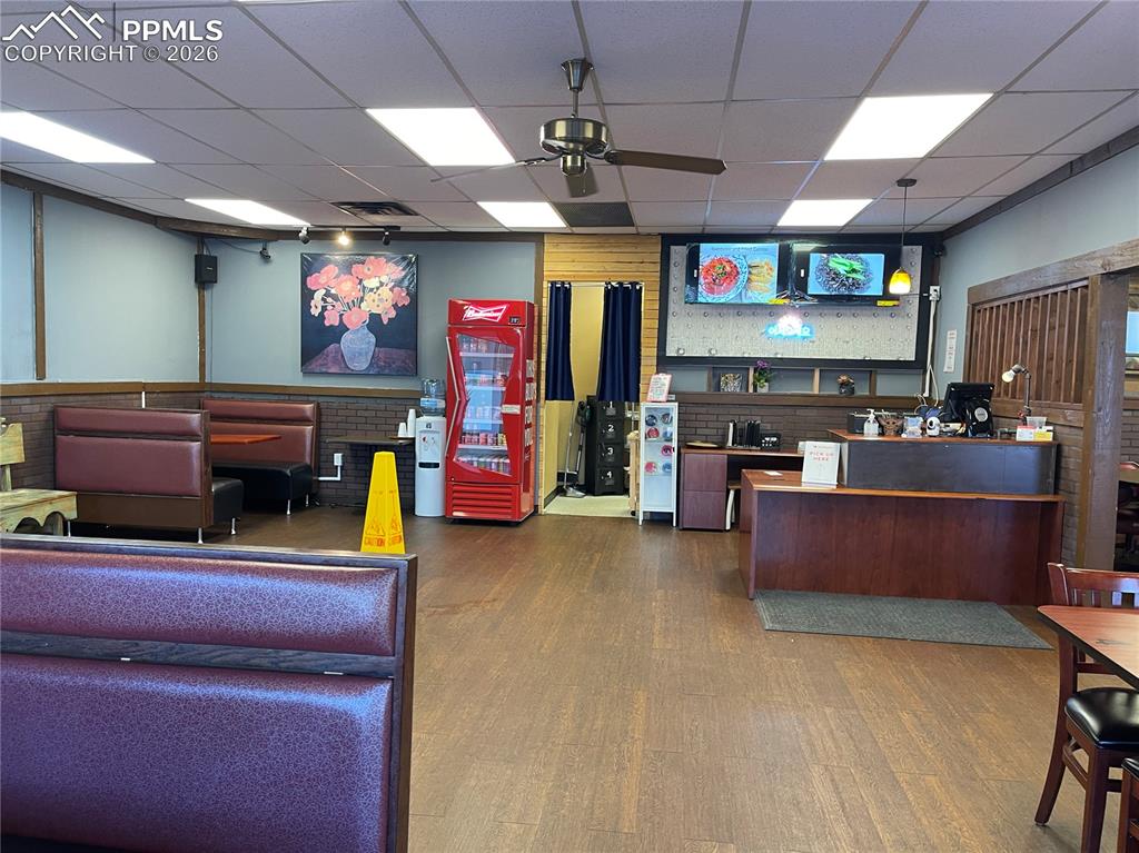 Image 7 of 9: Welcome area featuring a paneled ceiling