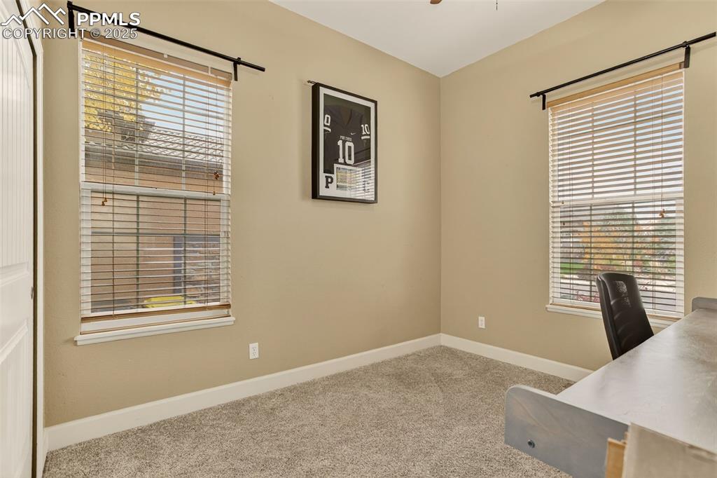 Image 15 of 40: Unfurnished office featuring light carpet and ceiling fan