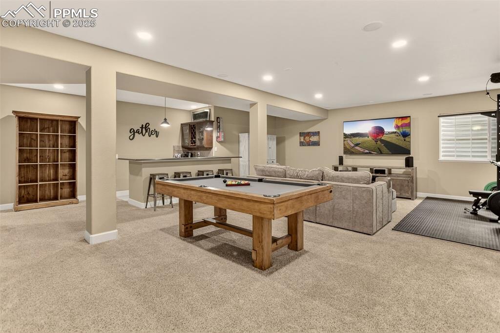 Image 23 of 40: Playroom featuring light colored carpet, recessed lighting, and billiards t