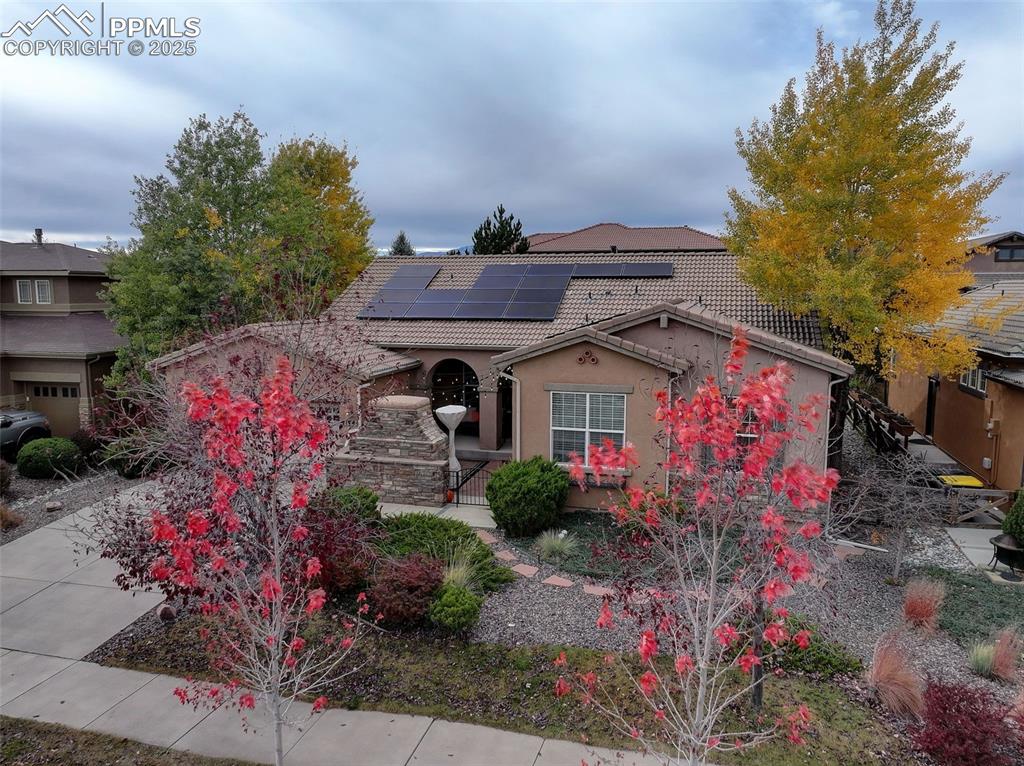 Image 32 of 40: Mediterranean / spanish-style home featuring a tiled roof, stucco siding, a