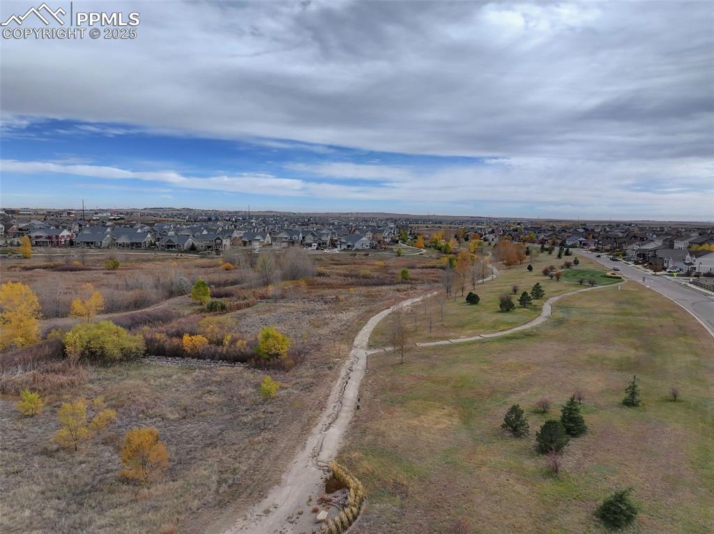 Image 38 of 40: Aerial view of property and surrounding area featuring nearby suburban area