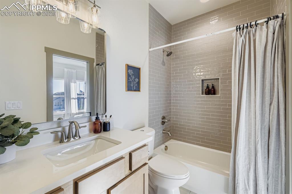 Image 13 of 41: Full bathroom with dual access from the hallway and Bedroom 2—convenient fo