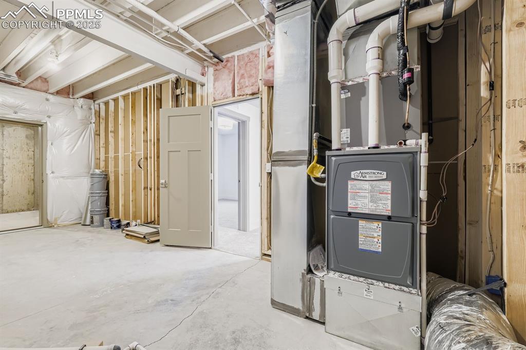 Image 22 of 41: Mechanical room includes additional space for tools, seasonal items, and ho