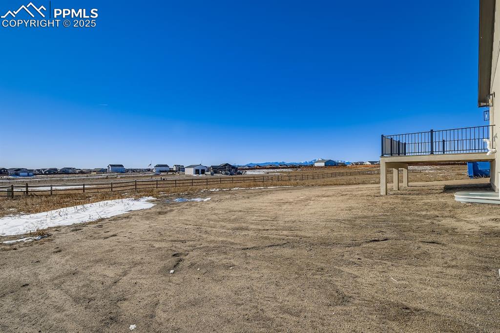 Image 31 of 41: Expansive 0.52-acre homesite with level landscape and beautiful mountain vi