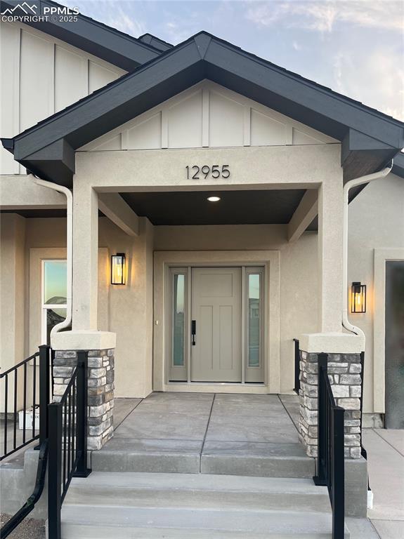 Image 41 of 41: Charming front door with gabled porch adds classic Craftsman curb appeal.